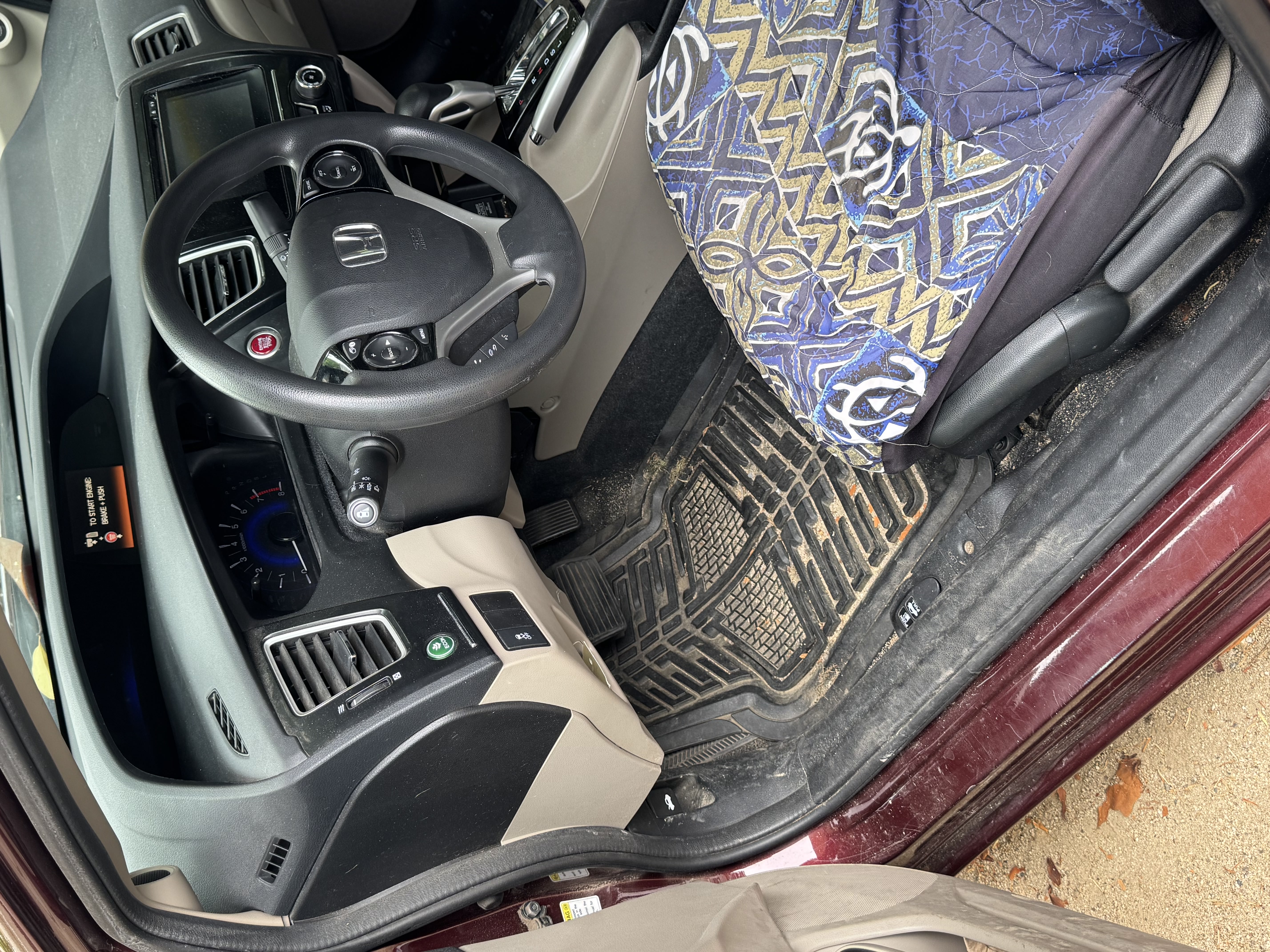 Dirty sandy vehicle interior before detailing